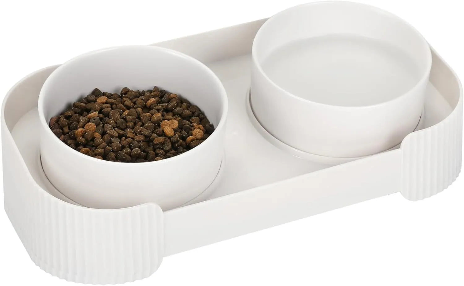 Green ceramic elevated cat feeder with two tilted bowls on a non-slip stand