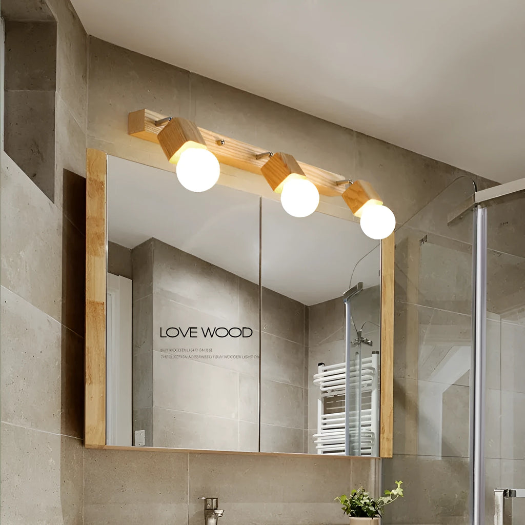 Single head 24cm LED wall lamp mounted beside a mirror.