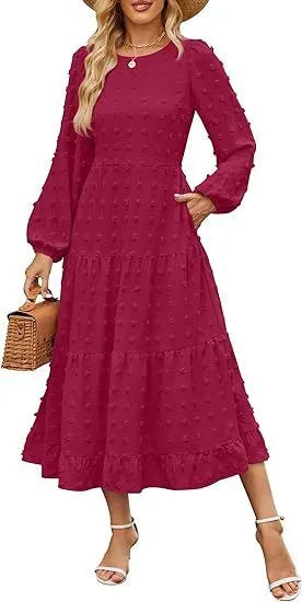 A beige high-waisted long sleeve dress with ruffled sleeves on a hanger.