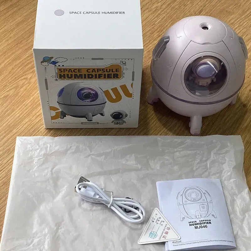 Astronaut-themed desktop USB humidifier with colourful LED lights and water tank.