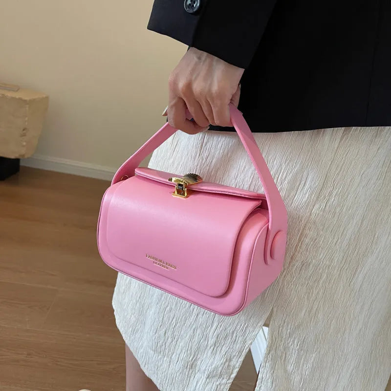 Personalised women's messenger shoulder bag with a letter detail in PU leather, shown in beige colour.