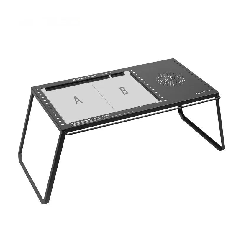 Folding carbon steel camping table with IGT modular system and multiple cell board design options.