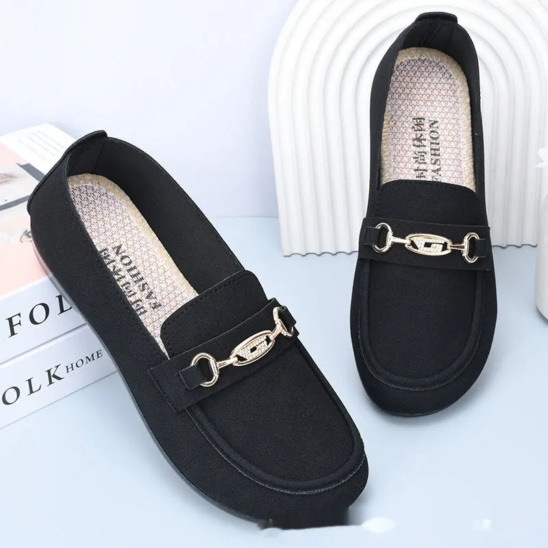 Gommino women's casual slip-on shoes in black with soft rubber sole and round toe