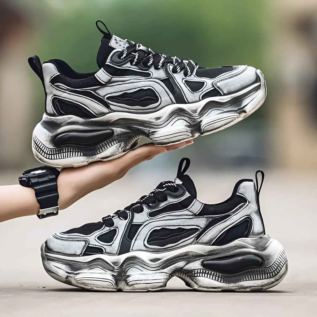Men's black and white low-top mesh sneakers with a platform sole and lace-up front.