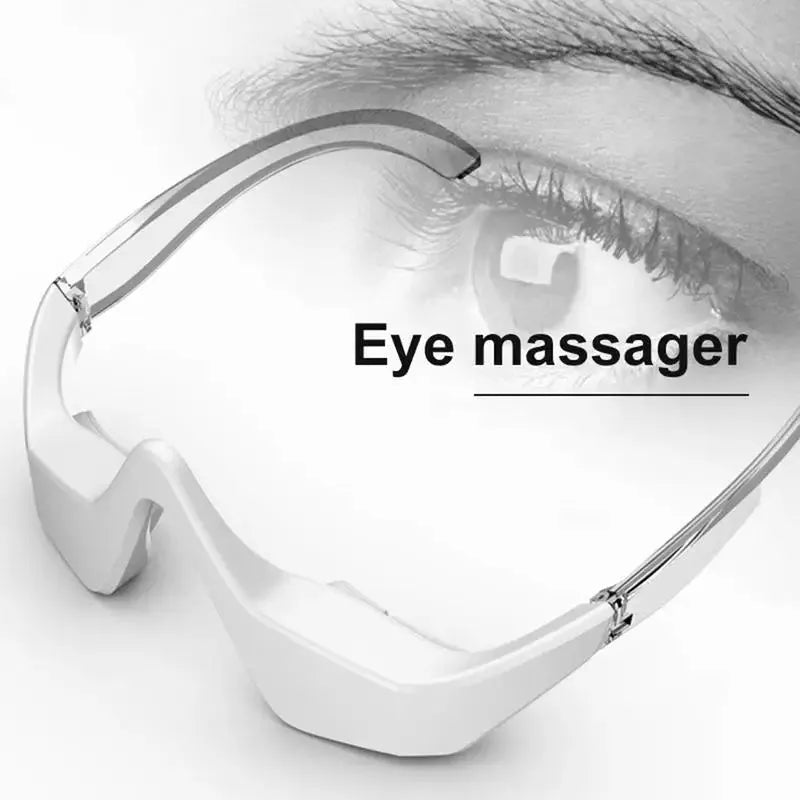 Pink and white micro-current eye massager with glasses-style design on a stand.