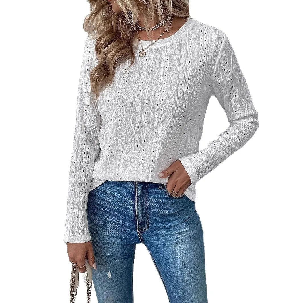White loose fit women's long sleeve round neck t-shirt laid flat