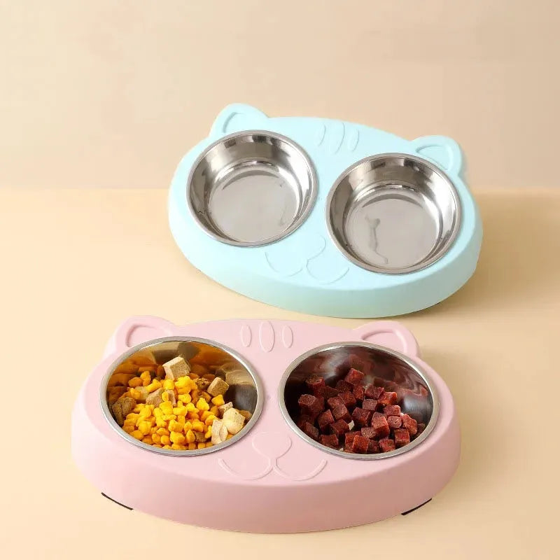 Blue plastic double-bowl pet food and water feeder tray with non-skid base.