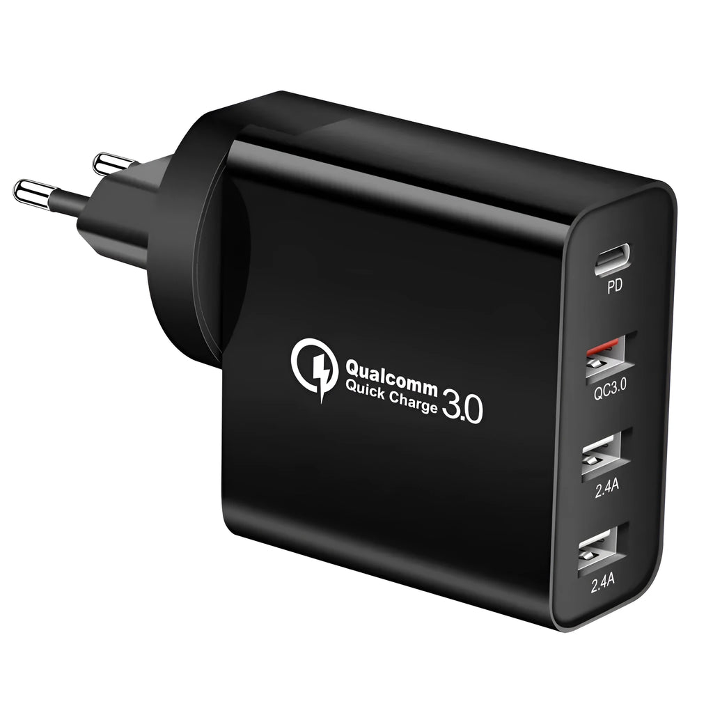 White fast charge wall charger with multiple USB ports on a table.