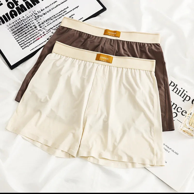 Men's solid colour loose fit ice silk underwear in a multi-pack on a grey background.