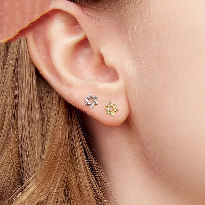 Pair of S925 sterling silver six-pointed star stud earrings on a flat surface, silver colour, 1 cm diameter