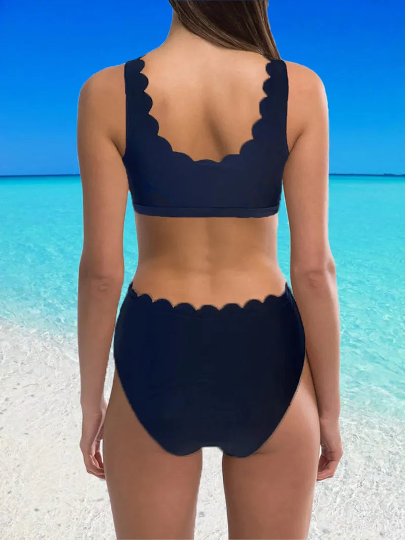 Women's red high waist split swimsuit with gathering detail on a mannequin.
