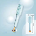 Blue, pink, and white dual-sided soft bristle brush for grooming small dogs