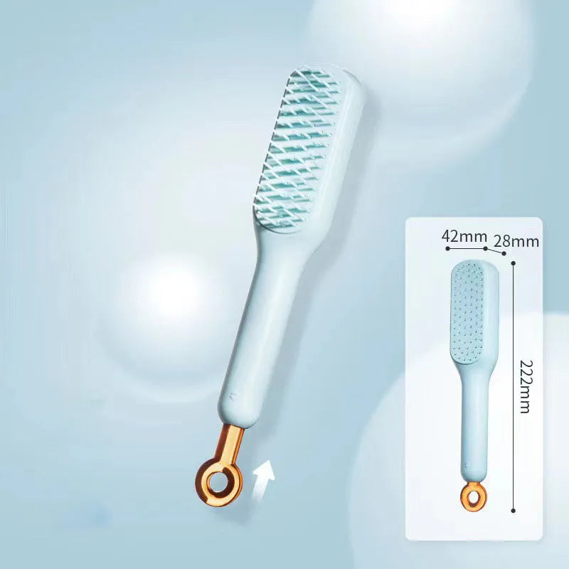 Blue, pink, and white dual-sided soft bristle brush for grooming small dogs