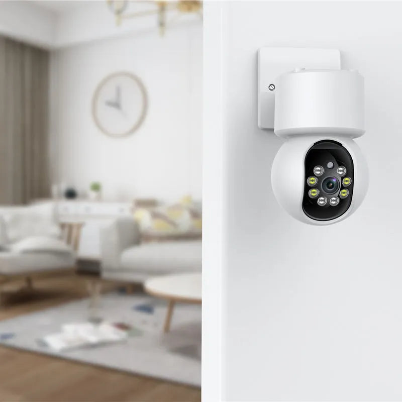 White wireless indoor security camera with 360-degree rotation capability on stand
