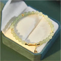 Glass and coloured glaze bracelet with floral design and ruyi elements in retro style