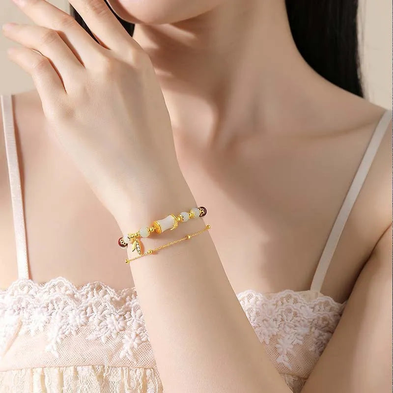 Glass and coloured glaze bracelet with floral design and ruyi elements in retro style
