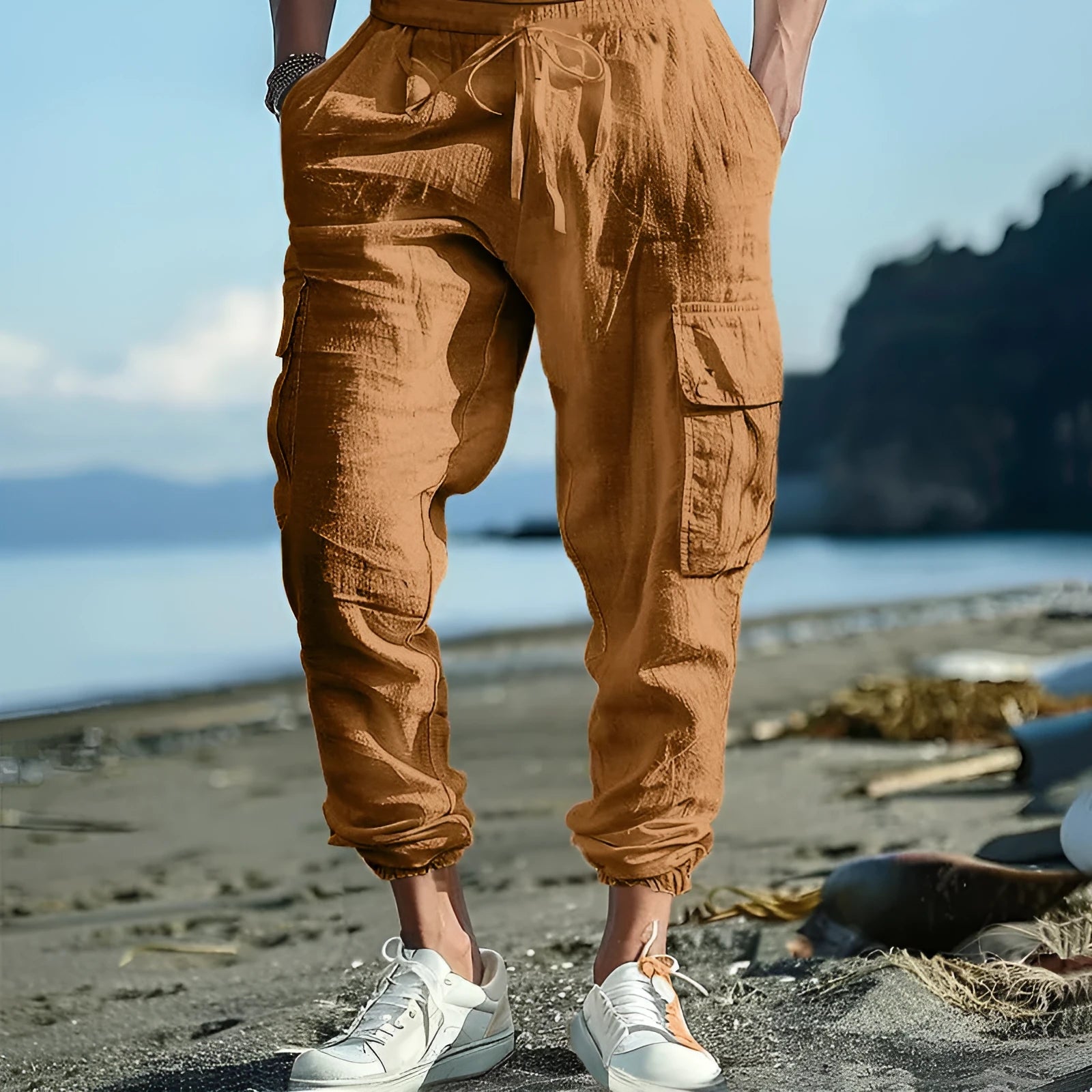 Man wearing loose-fit khaki linen casual trousers with ankle ties and multiple pockets.