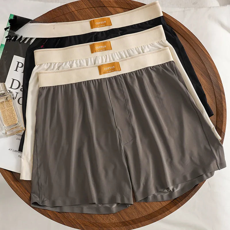 Men's solid colour loose fit ice silk underwear in a multi-pack on a grey background.