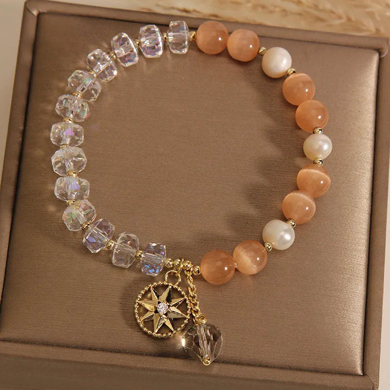 Gold-plated women's bracelet with orange crystal eight Awn star design