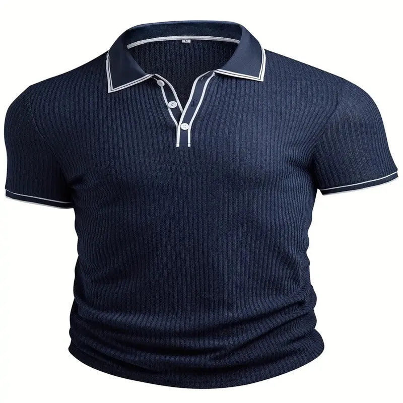 Man modelling a striped loose-fit short-sleeved polo shirt in a dark blue colour.