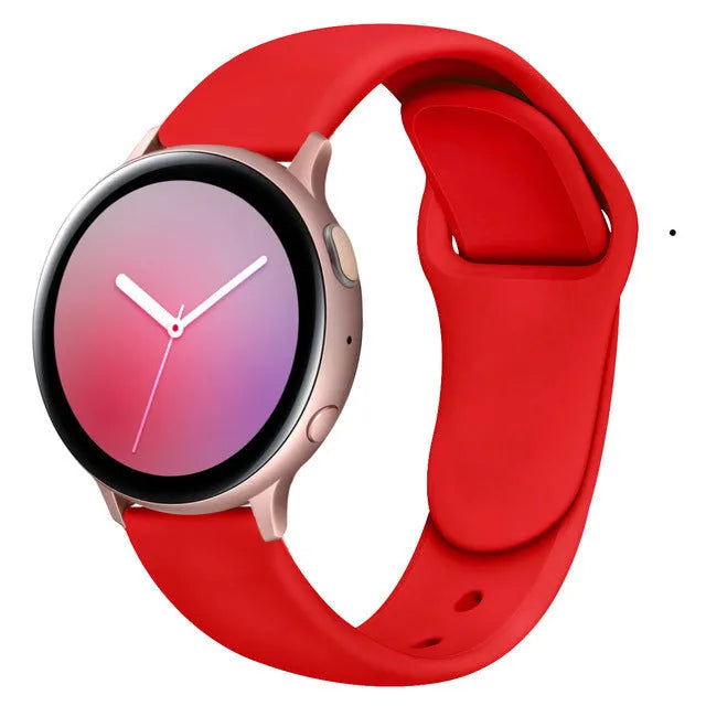 Samsung Galaxy Active 2 watch with a purple reverse buckle silicone strap on a wrist.