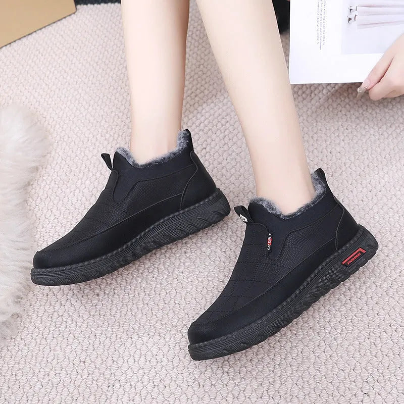 Women's black flat casual ankle boots with round toe and synthetic leather upper