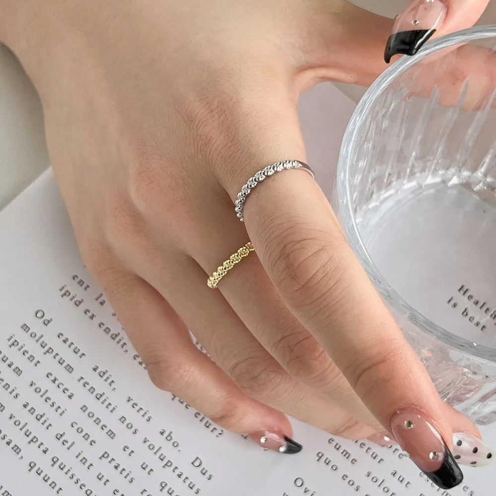 S925 sterling silver ring with geometric twist design in white gold colour finish