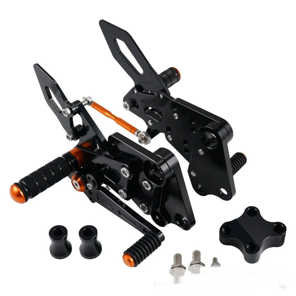 Black and orange KTM Duke motorcycle rear shift pedal support bracket assembly.