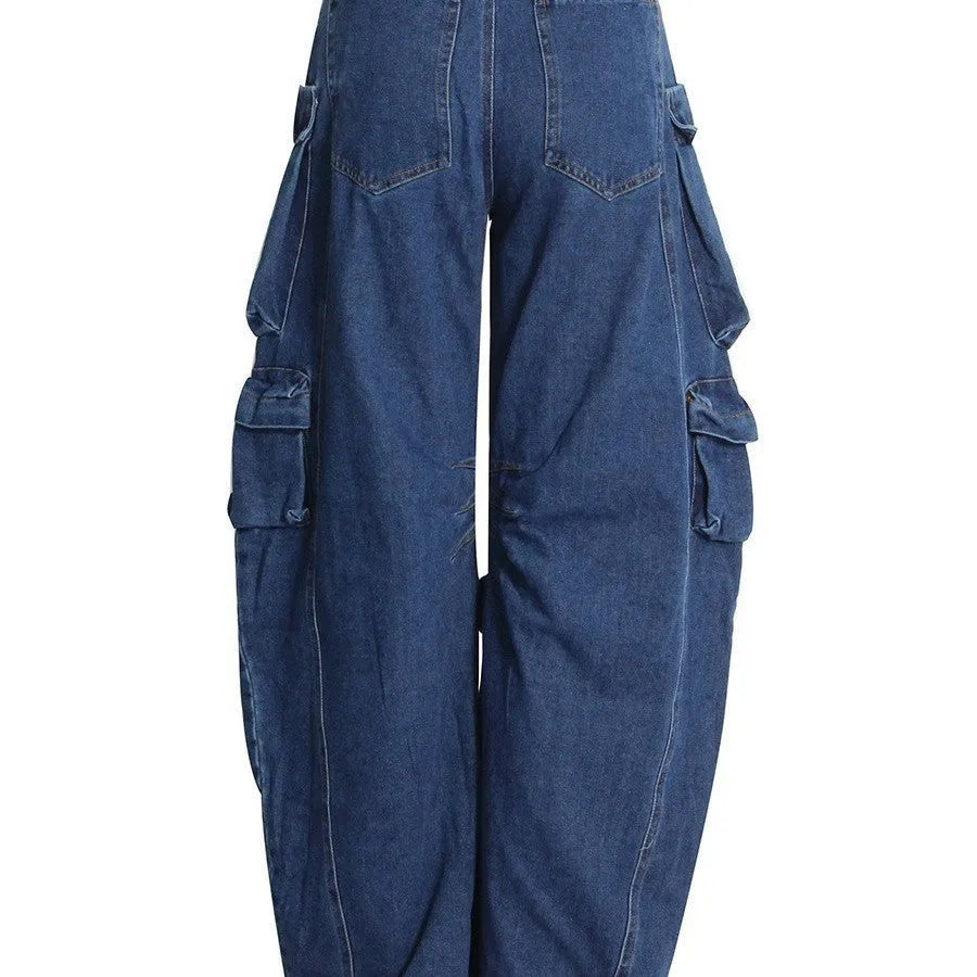 Dark blue distressed wide-leg jeans with a high waist and multiple pockets on a hanger