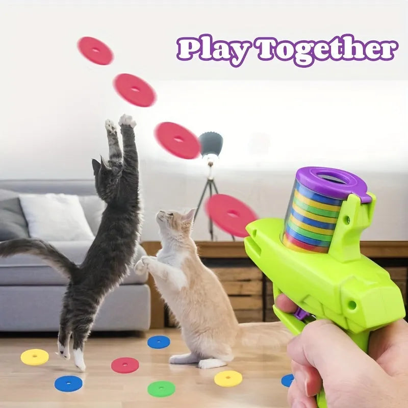 Green battery-free cat toy launcher with foam disc for indoor feline play