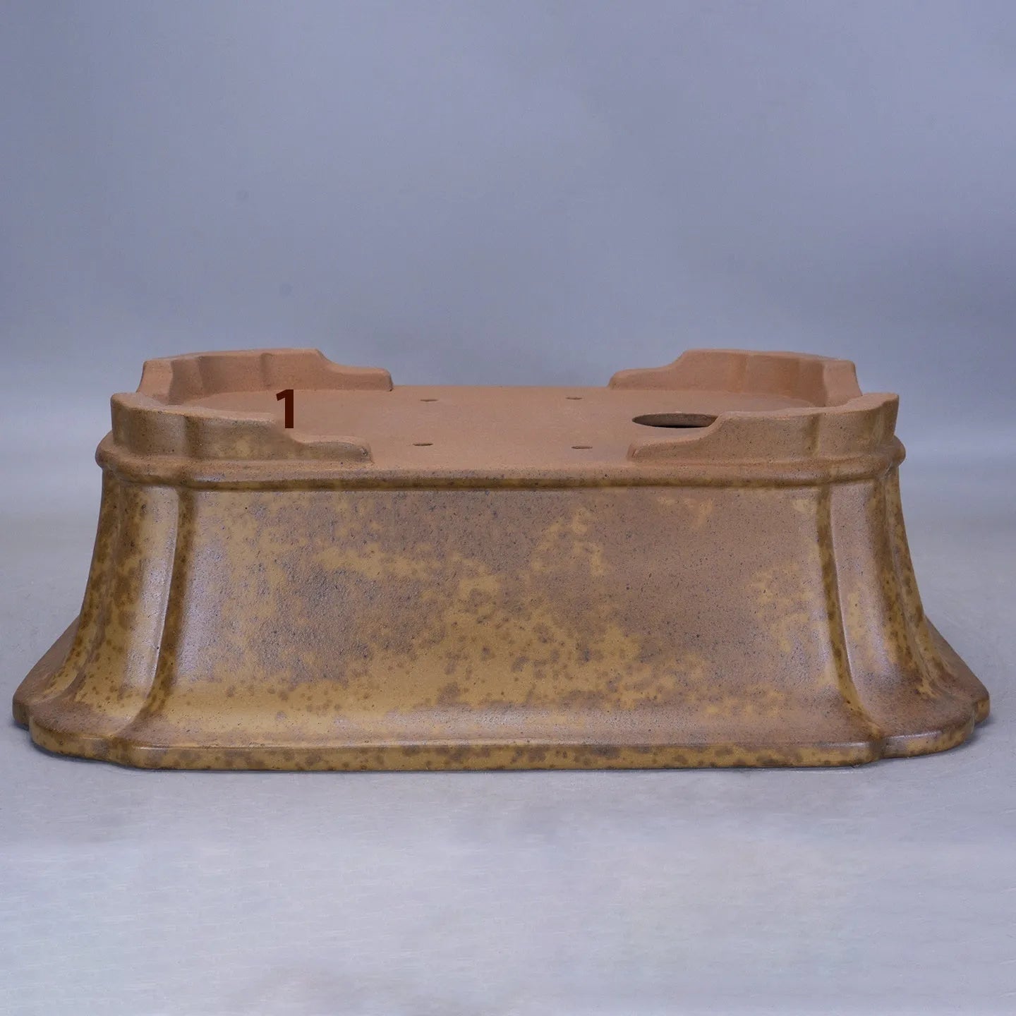 Modern rectangular purple sand floor planter with a visible water level gauge on its side.