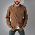 A regular-fit denim cardigan coat in khaki hanging on a rail.
