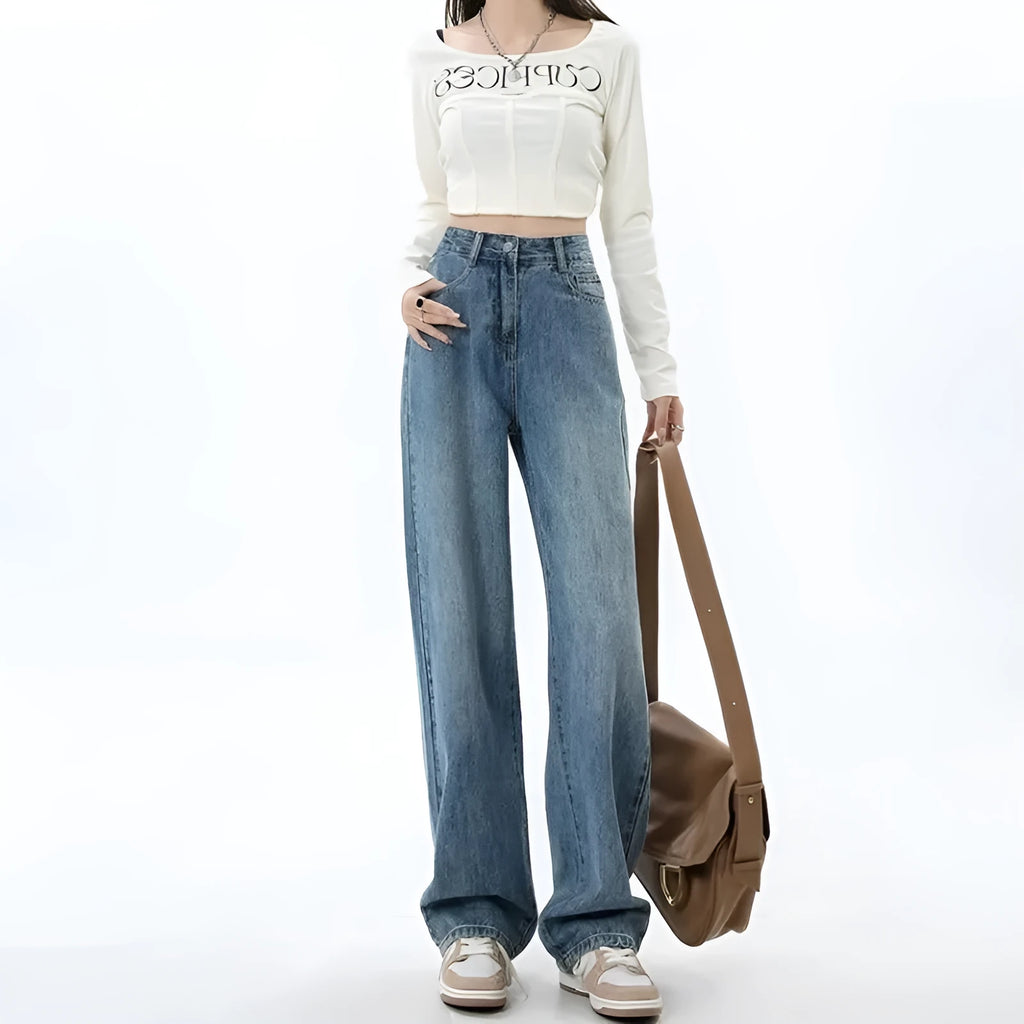 Woman wearing retro blue high-waist wide leg denim jeans with a relaxed fit.