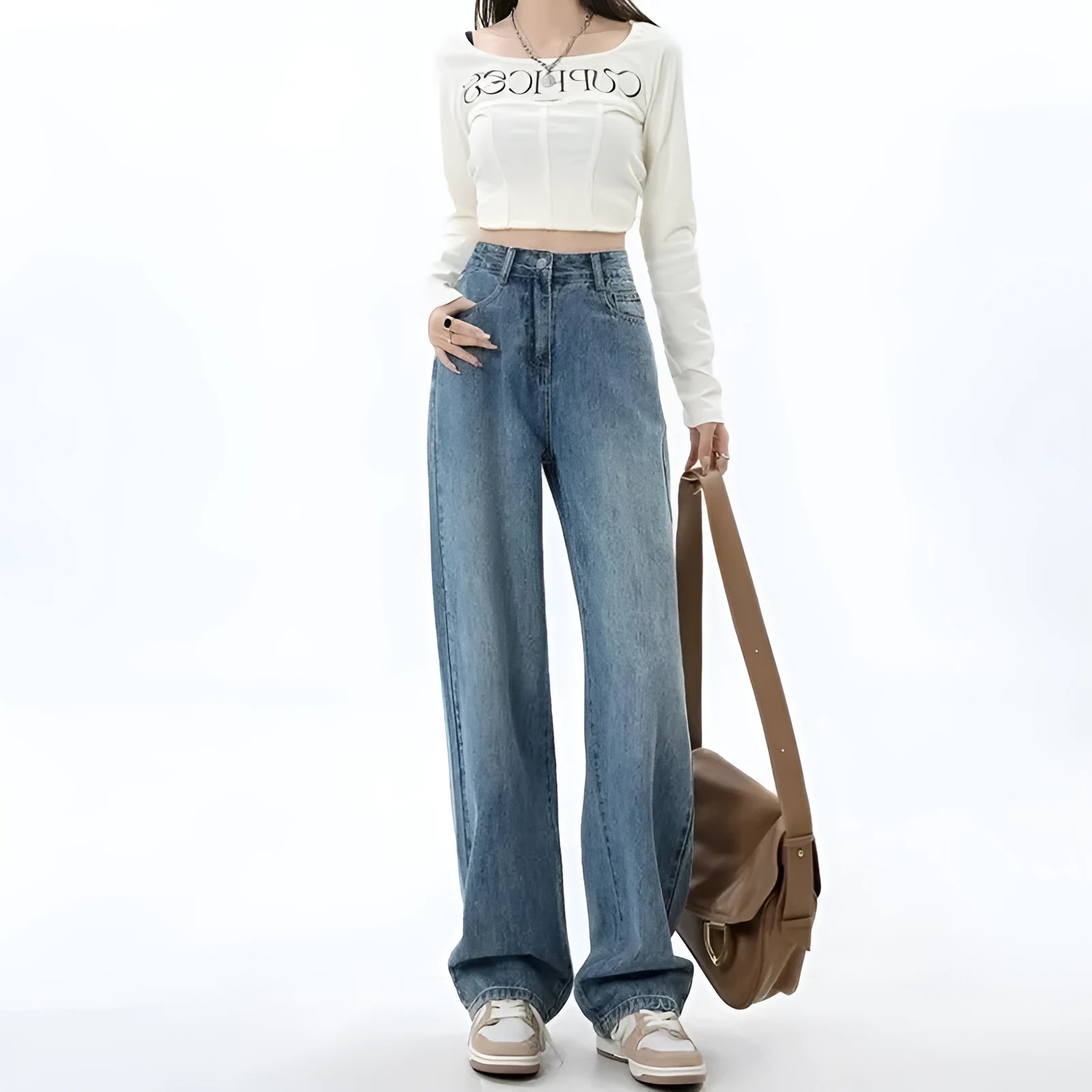 Woman wearing retro blue high-waist wide leg denim jeans with a relaxed fit.