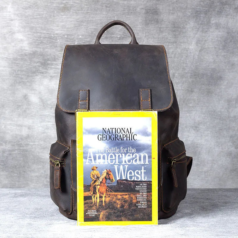Brown crazy horse leather backpack with denim lining and double shoulder straps.