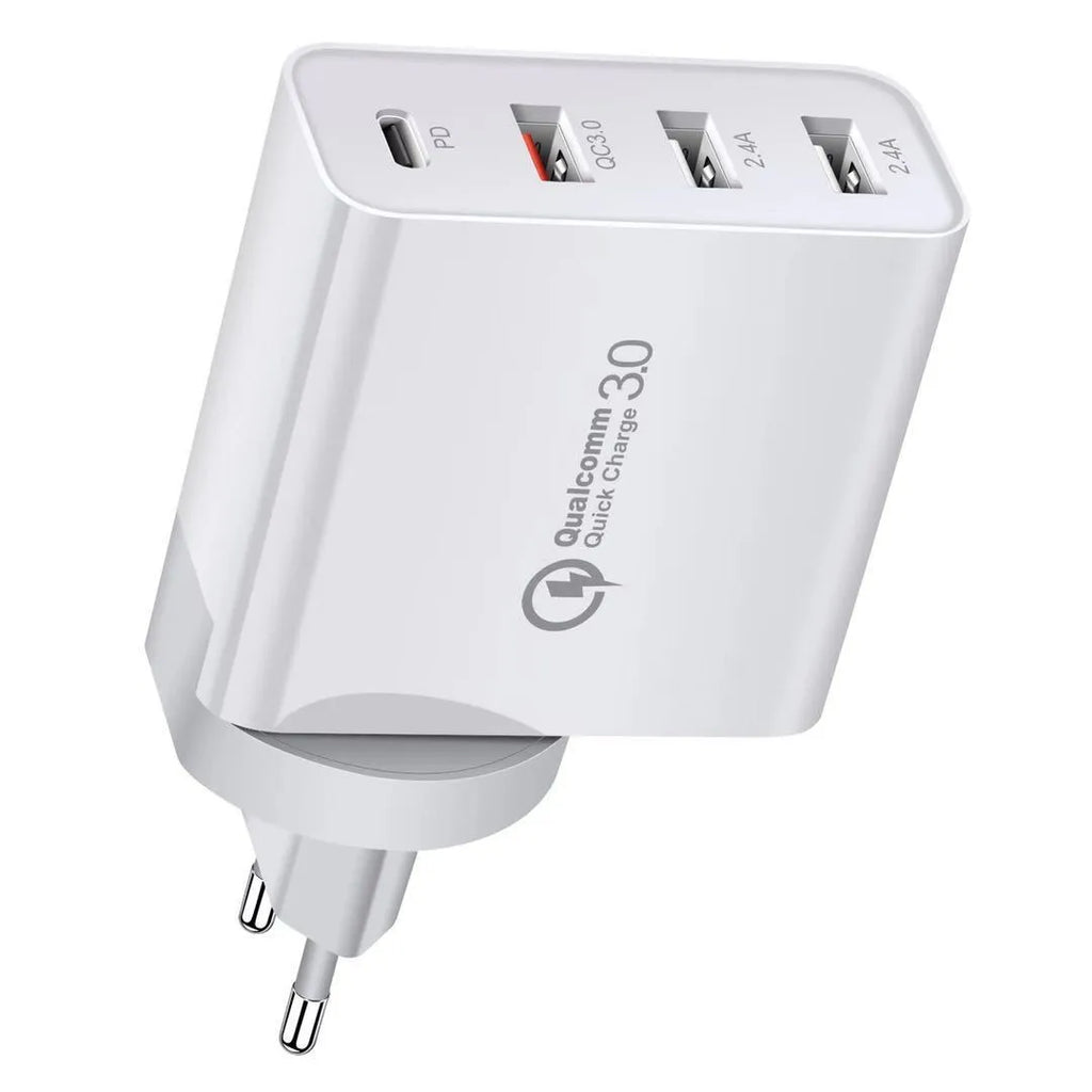 White fast charge wall charger with multiple USB ports on a table.