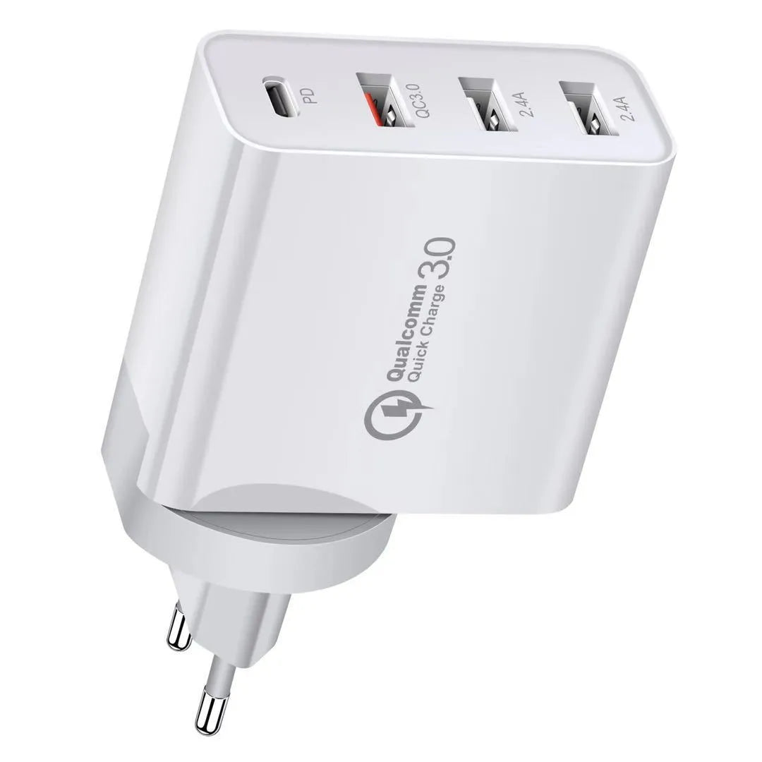 White fast charge wall charger with multiple USB ports on a table.