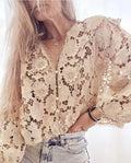 Black loose fit cardigan with white 3D lace floral decoration and a V-neckline