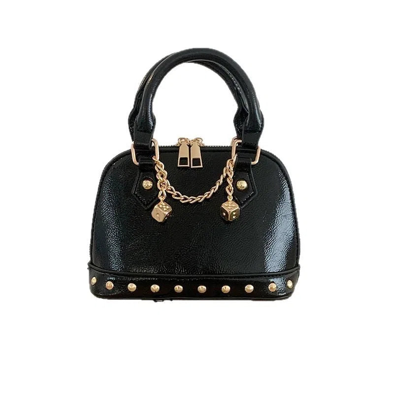 Champagne-gold PU shell bag with stitched seams, shown in shoulder mode against a neutral background