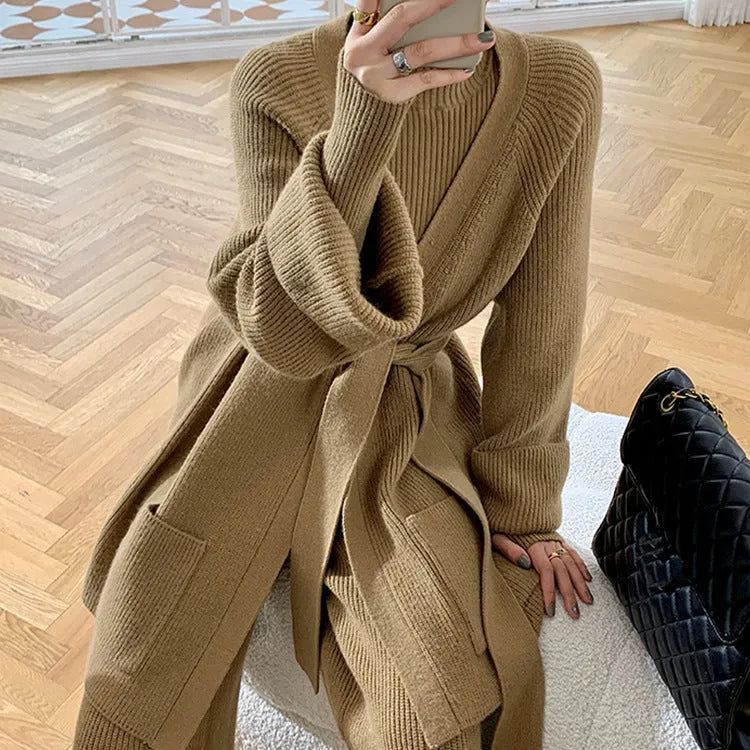 Women's apricot knitted three-piece set with cardigan, top, and wide-leg trousers on a hanger.