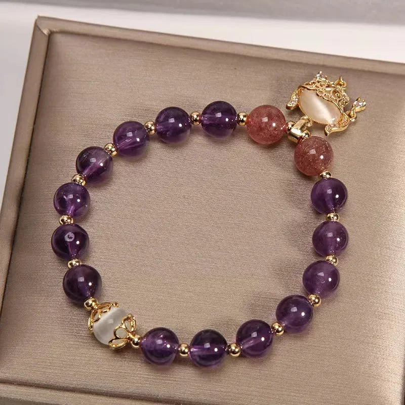 Women's copper bracelet with natural amethyst gemstones and drop-shaped longevity lock charm
