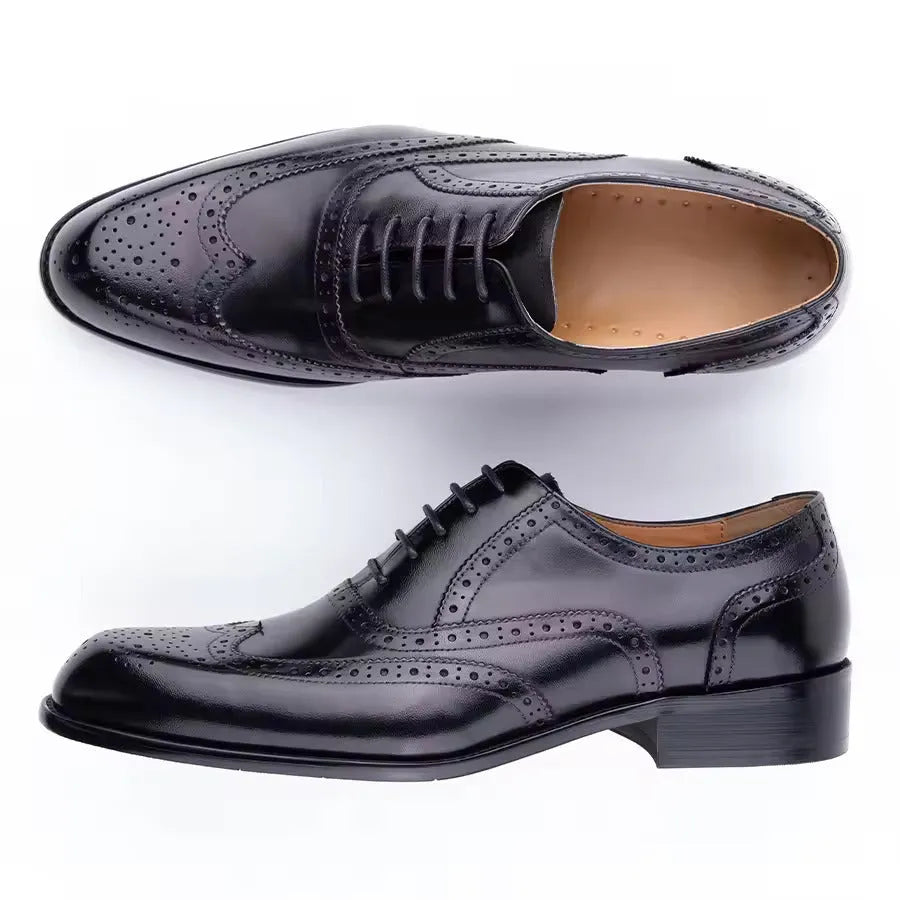 Men's purple leather Oxford dress shoes with hand-carved detail and pointed toe on a rubber sole.