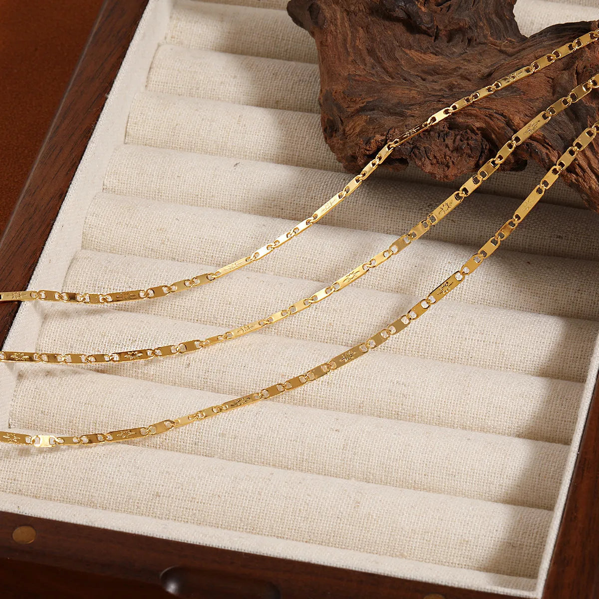 Gold electroplated titanium steel necklace with hammer pattern and Chinese character pendant on a stud chain
