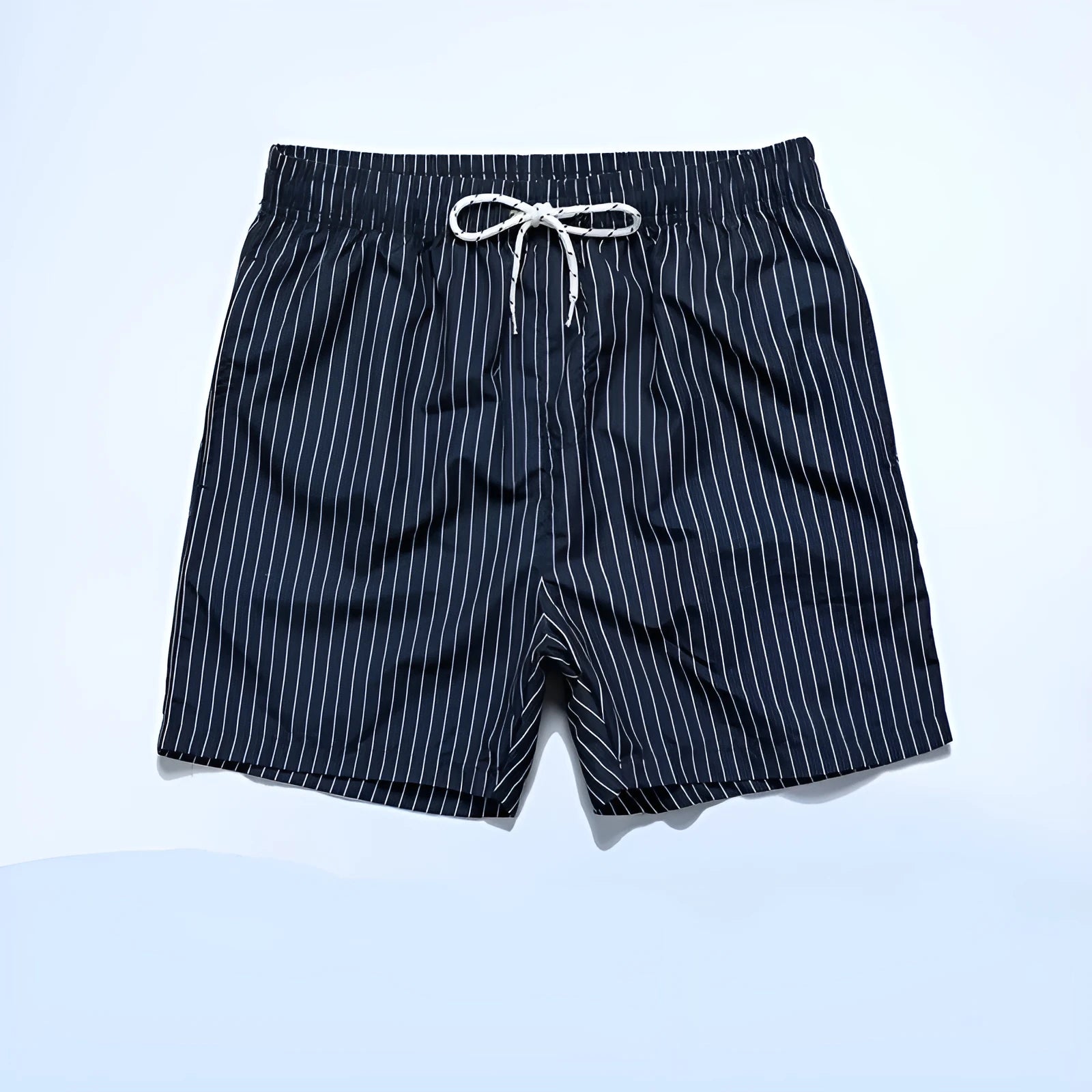Polyester fibre beach shorts with striped triangle lining in straight leg design