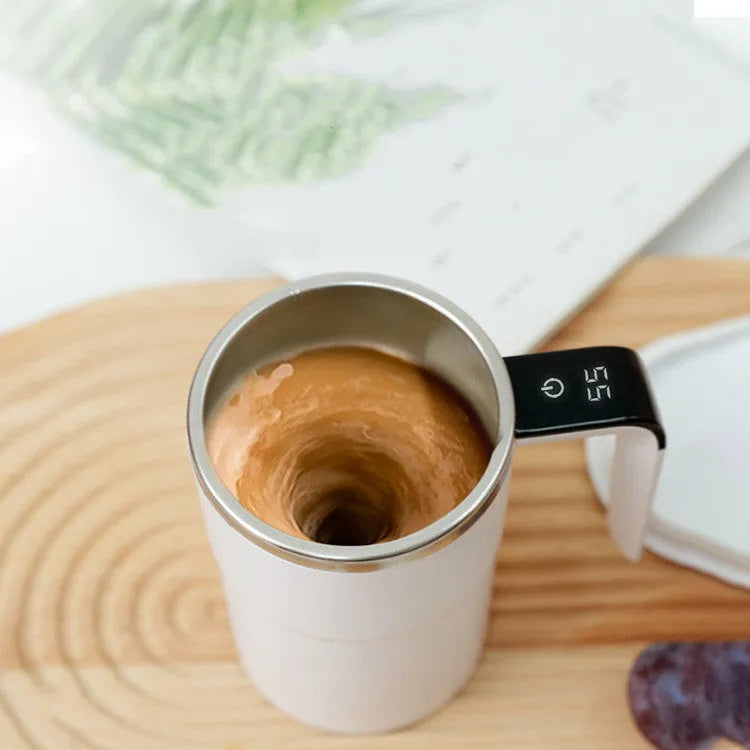 White automatic stirring electric mug with LCD temperature display and USB charging cable