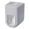 Nordic automatic toothpaste dispenser wall mounted in pink colour with compact 9x6x6cm design