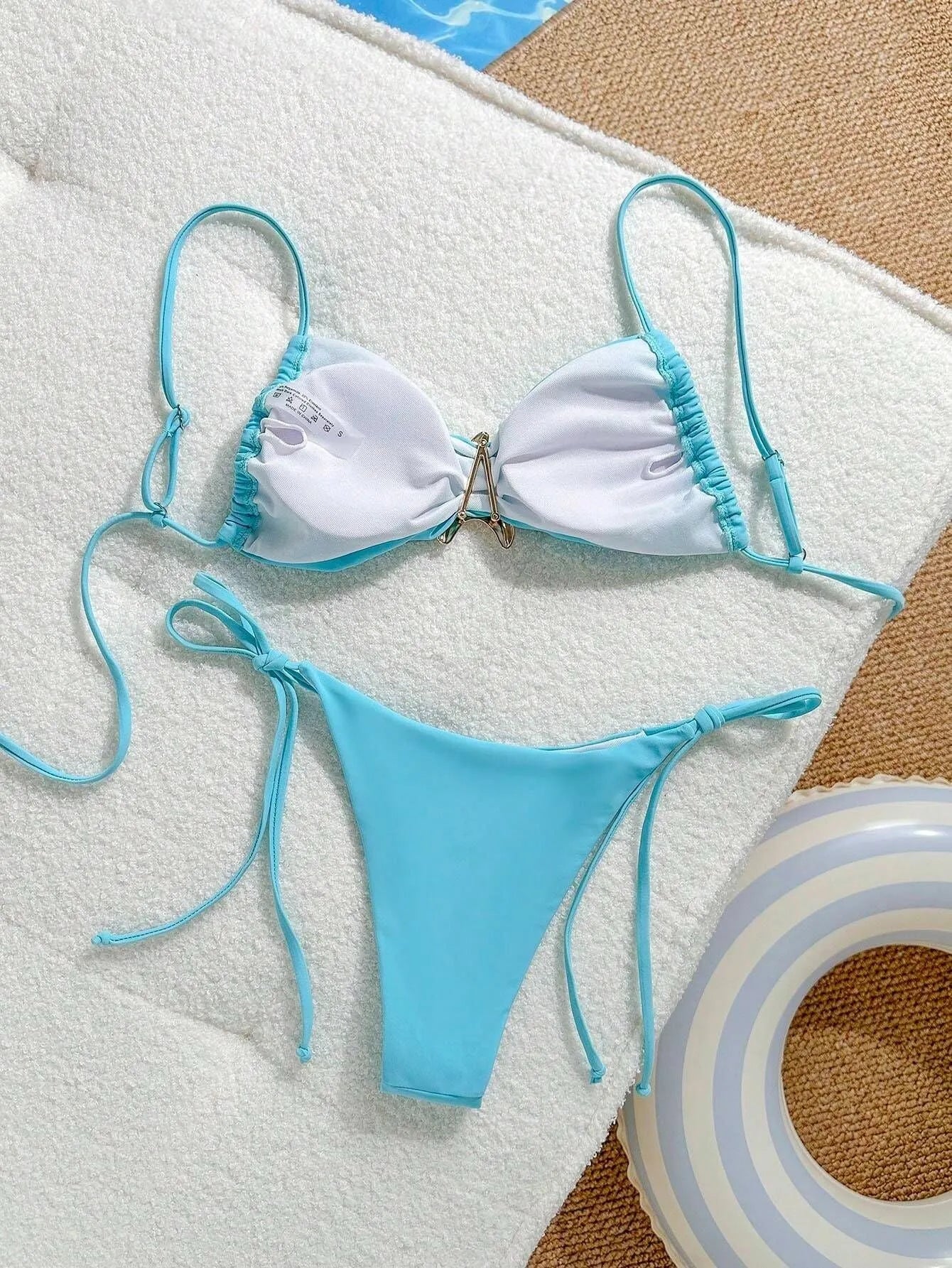 XINGX women's split bikini in solid colour with backless briefs, available in sky blue, black, or brown for swimming and wading.