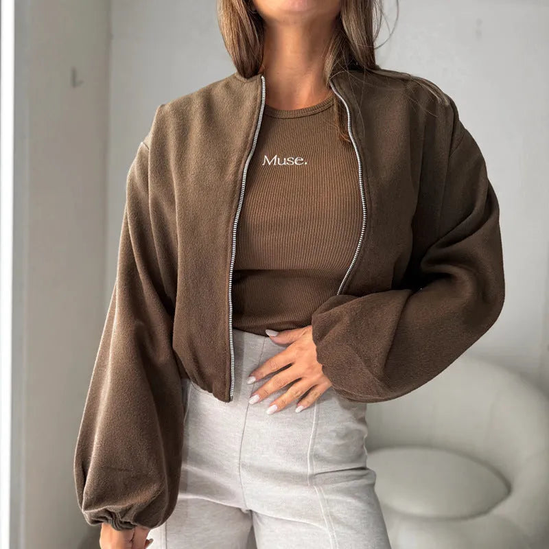 Women's off-shoulder short coat with lantern sleeves and round neck in brown.