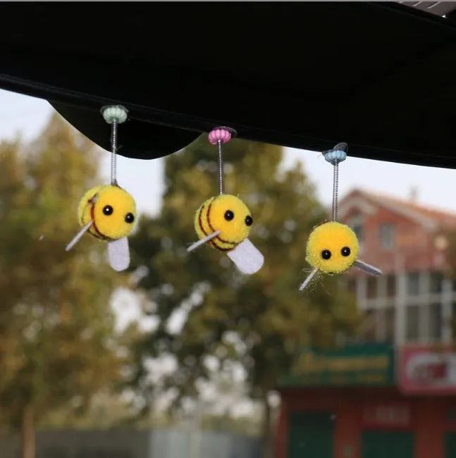 Swing Spring Bee car decoration with fur ball material and cartoon design measuring 3x3 cm