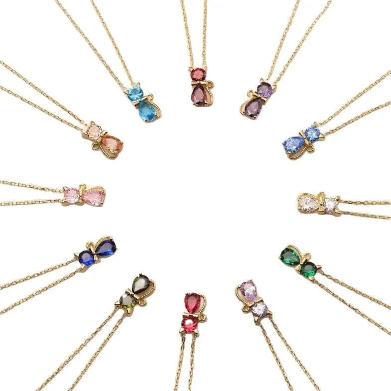 Sweet fashion necklace with titanium steel kitty pendant and coloured zircon stones on copper water wave chain.